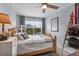 Bright bedroom with a baseball theme and decor, a comfortable bed, and a large window at 701 Little Hampton Ln, Gotha, FL 34734
