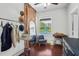 Functional dressing room with organized clothing racks, vintage sewing table and bright view of the pool at 701 Little Hampton Ln, Gotha, FL 34734