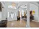 Welcoming foyer with chandelier, arched doorways, and elegant decor at 701 Little Hampton Ln, Gotha, FL 34734