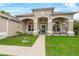 Charming home featuring a well-manicured lawn, inviting front porch, and decorative architectural details at 701 Little Hampton Ln, Gotha, FL 34734