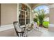 Inviting covered front porch with rocking chair and ample seating at 701 Little Hampton Ln, Gotha, FL 34734
