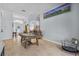Open concept game room with a large pool table and neutral tile floors throughout at 701 Little Hampton Ln, Gotha, FL 34734