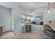 Open concept kitchen area with a window view of the screened-in pool and patio at 701 Little Hampton Ln, Gotha, FL 34734