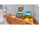 Cozy living room featuring two televisions and a couch with colorful pillows for ultimate comfort at 701 Little Hampton Ln, Gotha, FL 34734