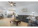 Cozy living room adjacent to the kitchen, with a comfortable sectional sofa and modern decor at 701 Little Hampton Ln, Gotha, FL 34734