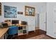 Office space with wood floors, light blue walls, desk, and gallery wall at 701 Little Hampton Ln, Gotha, FL 34734
