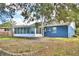 Backyard view of the house with a screened-in porch and entrance at 7504 Willow Wisp E Dr, Lakeland, FL 33810