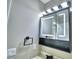 The bathroom mirror has integrated lights and a modern towel rack at 7504 Willow Wisp E Dr, Lakeland, FL 33810