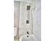 Updated bathroom features modern shower hardware over a tiled shower and tub at 7504 Willow Wisp E Dr, Lakeland, FL 33810