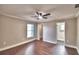 The bedroom has hardwood floors, a ceiling fan, and two doors at 7504 Willow Wisp E Dr, Lakeland, FL 33810