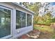 Back of home and screened in lanai with a view to the exterior back yard at 7504 Willow Wisp E Dr, Lakeland, FL 33810