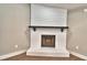 Charming living room with a white brick fireplace at 7504 Willow Wisp E Dr, Lakeland, FL 33810