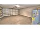 Spacious two-car garage with a concrete floor and water heater at 7504 Willow Wisp E Dr, Lakeland, FL 33810