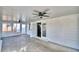 Spacious lanai featuring white wood paneling and ceiling fans at 7504 Willow Wisp E Dr, Lakeland, FL 33810