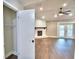 Spacious living room with fireplace, hardwood floors, and a closet plus double doors to the backyard at 7504 Willow Wisp E Dr, Lakeland, FL 33810