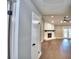 The open-concept living room features hardwood floors, a white brick fireplace, recessed lighting, and French doors at 7504 Willow Wisp E Dr, Lakeland, FL 33810