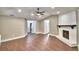 Spacious living room with hardwood floors, fireplace, neutral paint, and recessed lighting at 7504 Willow Wisp E Dr, Lakeland, FL 33810