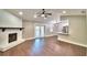 Large living room with hardwood floors, fireplace and space for dining or entertaining at 7504 Willow Wisp E Dr, Lakeland, FL 33810