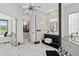 Luxurious bathroom with sleek fixtures, marble tile, a glass-enclosed shower, and stylish design at 8131 Vineland Oaks Blvd, Orlando, FL 32835