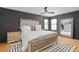 Sophisticated bedroom with mirrored accents, plush bedding, and ample natural light at 8131 Vineland Oaks Blvd, Orlando, FL 32835