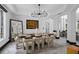 Bright dining room featuring modern lighting, a unique table, and contemporary decor at 8131 Vineland Oaks Blvd, Orlando, FL 32835