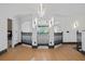 Bright foyer with dark accents and a multi-level railing with open doorway design at 8131 Vineland Oaks Blvd, Orlando, FL 32835