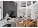 Stunning living room featuring soaring ceilings, a modern fireplace, and luxury finishes at 8131 Vineland Oaks Blvd, Orlando, FL 32835