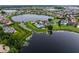 Breathtaking aerial view showcasing waterfront homes and community amenities at 8818 Bismarck Palm Dr, Winter Garden, FL 34787