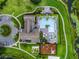 Gorgeous aerial view of a community pool, playground, and well-maintained landscaping at 8818 Bismarck Palm Dr, Winter Garden, FL 34787