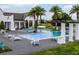 Community pool area offers comfortable seating, lovely landscaping and a relaxing atmosphere at 8818 Bismarck Palm Dr, Winter Garden, FL 34787