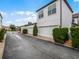 Stylish townhomes with white exterior, red tile roof and well-manicured landscaping at 8818 Bismarck Palm Dr, Winter Garden, FL 34787