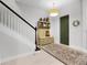 Inviting entryway with staircase, stylish rug, and decorative accents at 8818 Bismarck Palm Dr, Winter Garden, FL 34787