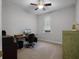 Cozy office with a ceiling fan, desk, and window view at 8818 Bismarck Palm Dr, Winter Garden, FL 34787