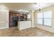 Updated kitchen with dark wood cabinets, breakfast bar, and tile flooring at 909 Charo Pkwy # 1011, Davenport, FL 33897