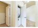 Hallway laundry closet featuring a stackable washer and dryer unit at 909 Charo Pkwy # 1011, Davenport, FL 33897