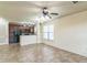 Open living space with tile flooring, and updated kitchen with dark cabinets at 909 Charo Pkwy # 1011, Davenport, FL 33897