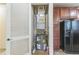 Utility closet with water heater and HVAC system, located near kitchen cabinets and refrigerator at 909 Charo Pkwy # 1011, Davenport, FL 33897