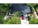 Aerial view showing a house with a nice roof, backyard with patio set, and cars parked in driveway at 955 Gamewell Ave, Maitland, FL 32751
