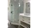 Modern bathroom with glass shower, marble countertop vanity, and updated fixtures at 955 Gamewell Ave, Maitland, FL 32751
