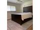 Bedroom features a modern bed frame, ceramic tile floors and window providing natural light at 955 Gamewell Ave, Maitland, FL 32751