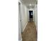 Hallway featuring ceramic tile flooring with multiple doors leading to other rooms in the home at 955 Gamewell Ave, Maitland, FL 32751