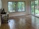 Bright office area featuring large windows and ceramic tile flooring leading to a sliding glass door at 955 Gamewell Ave, Maitland, FL 32751