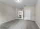 Bedroom with a carpet and view of a living space through an open doorway at 9670 Cypress Pine St, Orlando, FL 32827