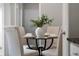 Charming dining area with a glass table, four chairs, and tasteful decor, perfect for intimate meals at 9670 Cypress Pine St, Orlando, FL 32827