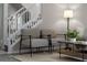 Inviting living room area showcasing modern furnishings, a cozy rug, and a view of the staircase at 9670 Cypress Pine St, Orlando, FL 32827