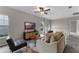 Upstairs living room with a modern sofa, a view of the windows, and a cozy atmosphere at 9670 Cypress Pine St, Orlando, FL 32827
