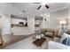 Open-concept living area seamlessly integrates with the kitchen, creating a harmonious and spacious atmosphere at 9670 Cypress Pine St, Orlando, FL 32827