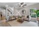 Inviting living area featuring a plush sofa, stylish decor, and bright windows for a welcoming atmosphere at 9670 Cypress Pine St, Orlando, FL 32827