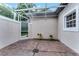 Enclosed patio featuring brick flooring, an overhead trellis and a fenced in yard at 9670 Cypress Pine St, Orlando, FL 32827