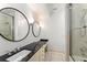 Bright bathroom with dual vanities, vessel sink and shower with glass door at 9743 Chestnut Ridge Dr, Windermere, FL 34786